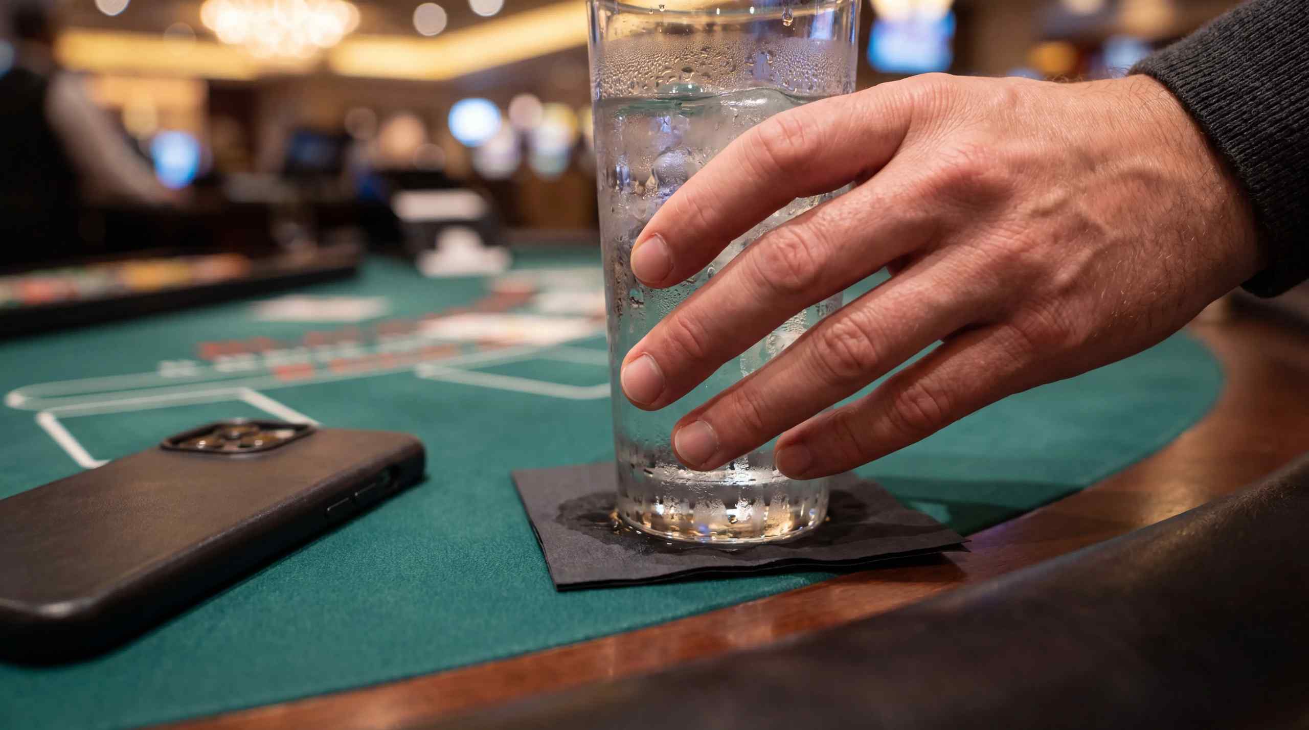 A glass of water on a poker table